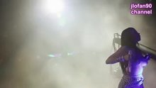 Nicki Minaj showing her breasts on stage.