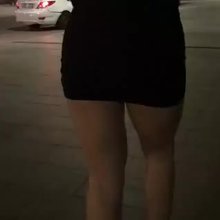 Down the street in a tight dress and heels