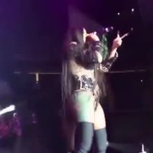 Cardi B claps her butt on stage