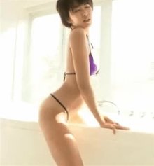 Japanese woman humping and cumming on the bathtub ledge