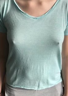 Bouncing her small breasts around under her shirt